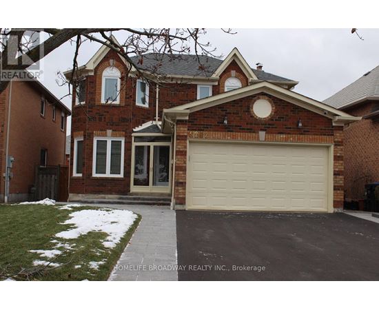 A brick house with a garage door in front.