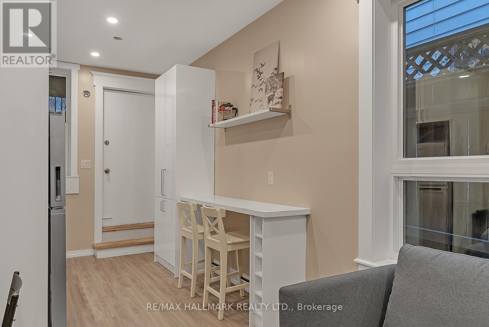 A small kitchen with a table and chairs.