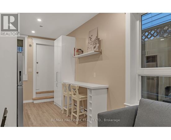 A small kitchen with a table and chairs.
