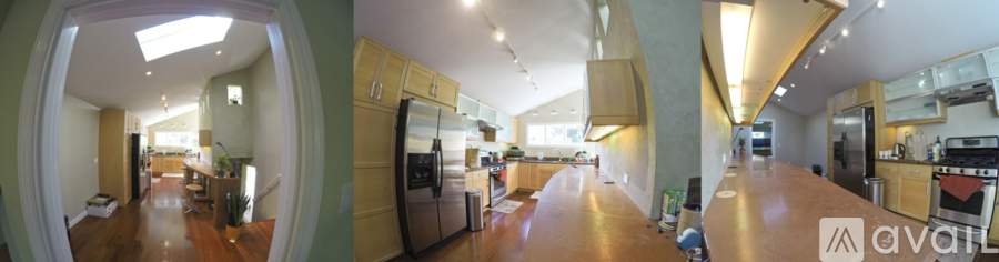 A modern kitchen with wooden cabinets and stainless steel appliances.