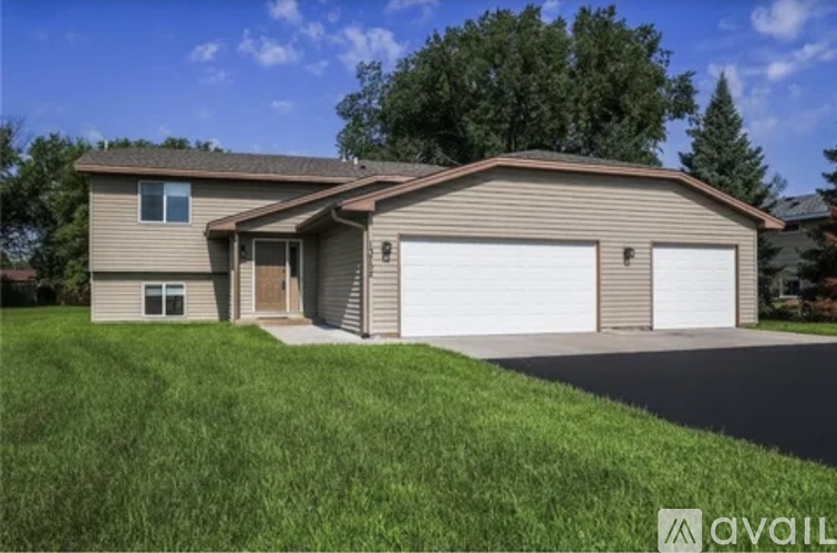 A house with a garage is available for sale.