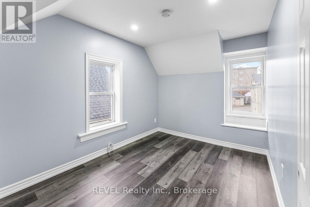 A room with grey walls and wooden flooring.