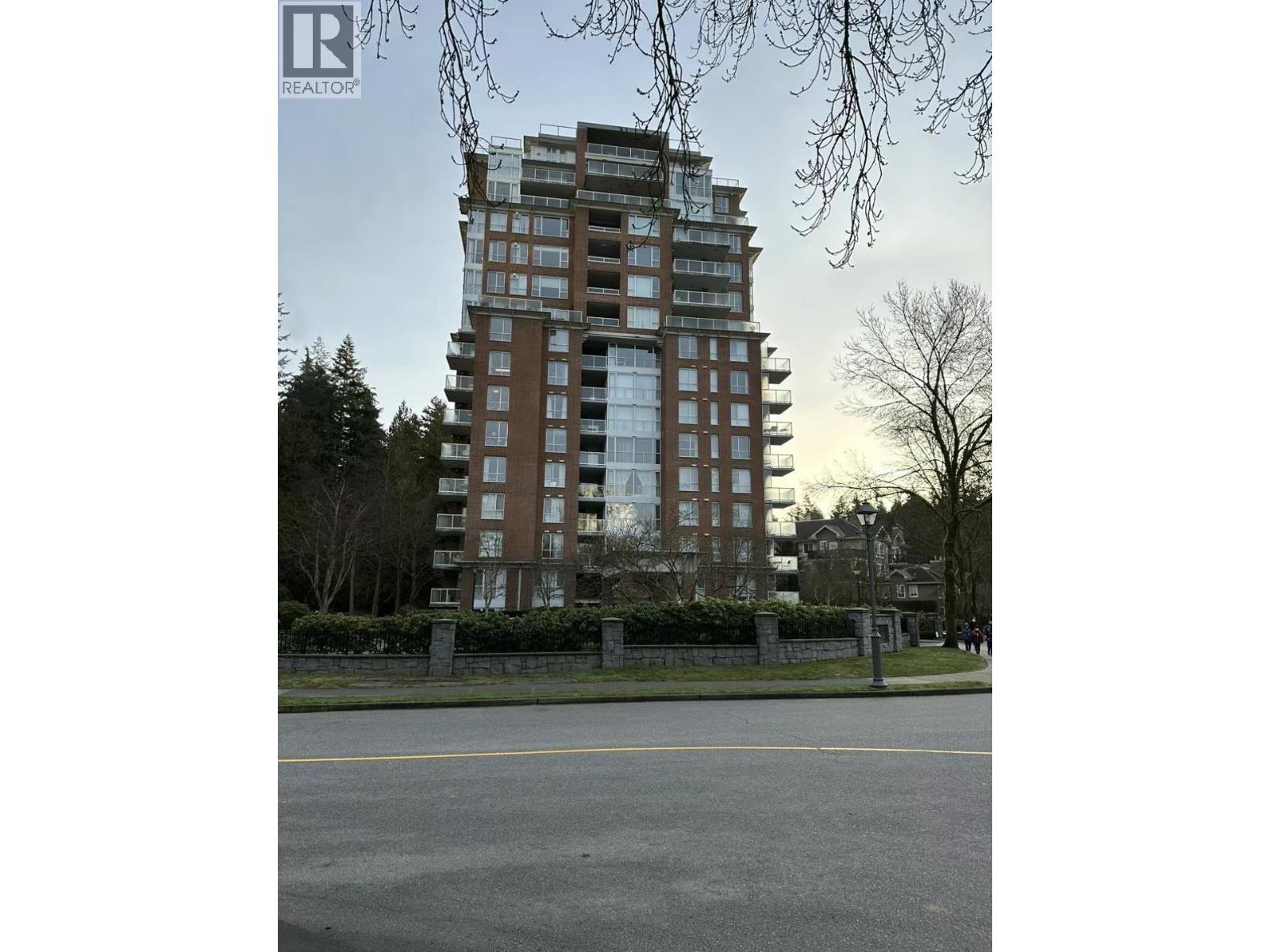 A tall residential building is seen in the image.