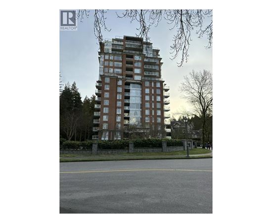 A tall residential building is seen in the image.
