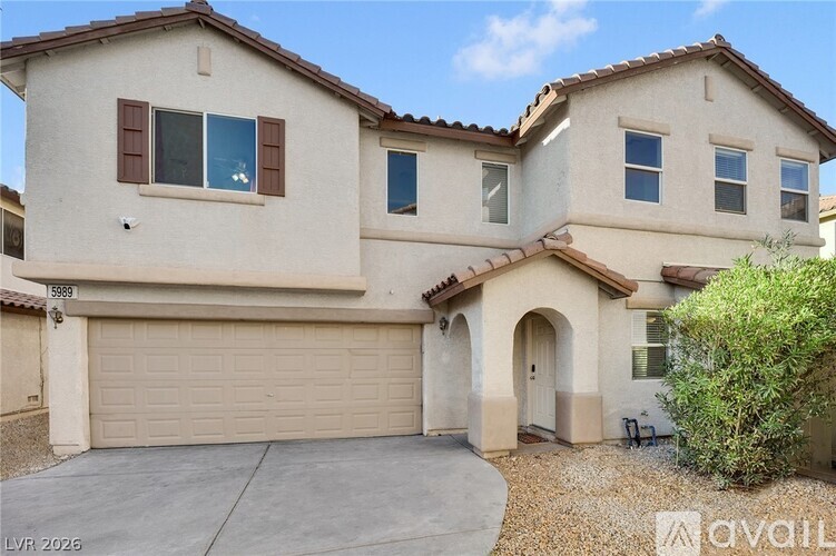 A spacious room with a ceiling fan and tiled flooring.