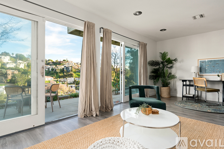 A modern living room with a view of the city.