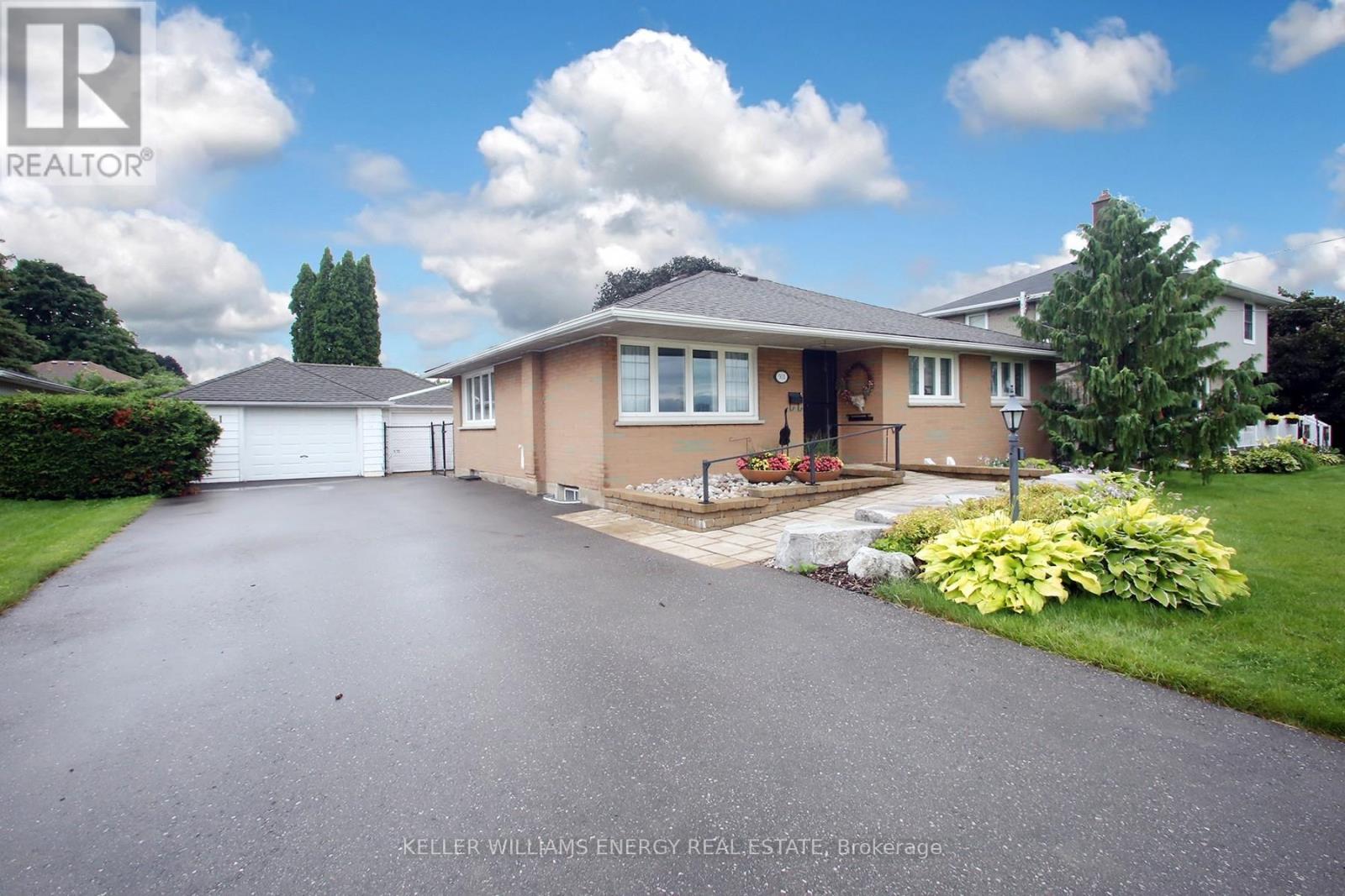 A house with a driveway in front of it.