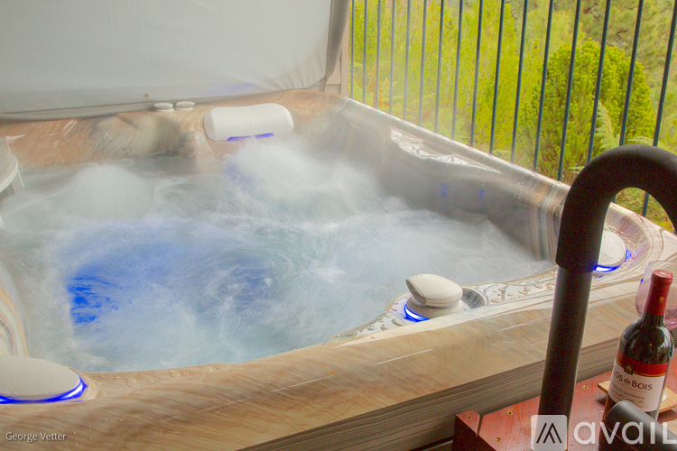 A hot tub with steam rising from it.