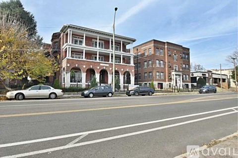 A street view with cars and buildings.