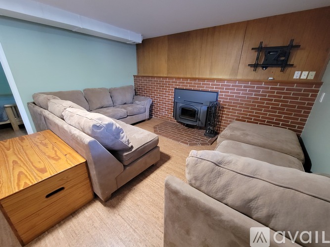 A living room with a fireplace and a couch.