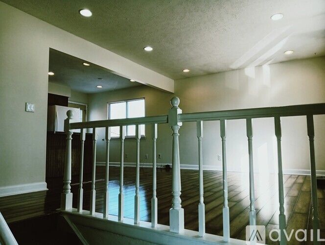 A room with a balcony and a window.