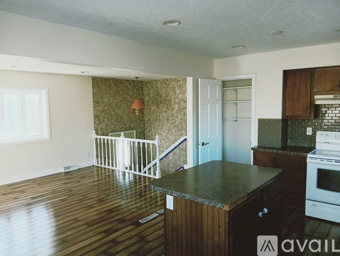 A kitchen with a white oven and a white fridge.