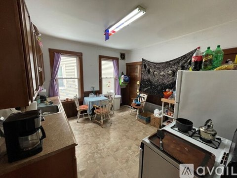 A kitchen with a table set for a meal.