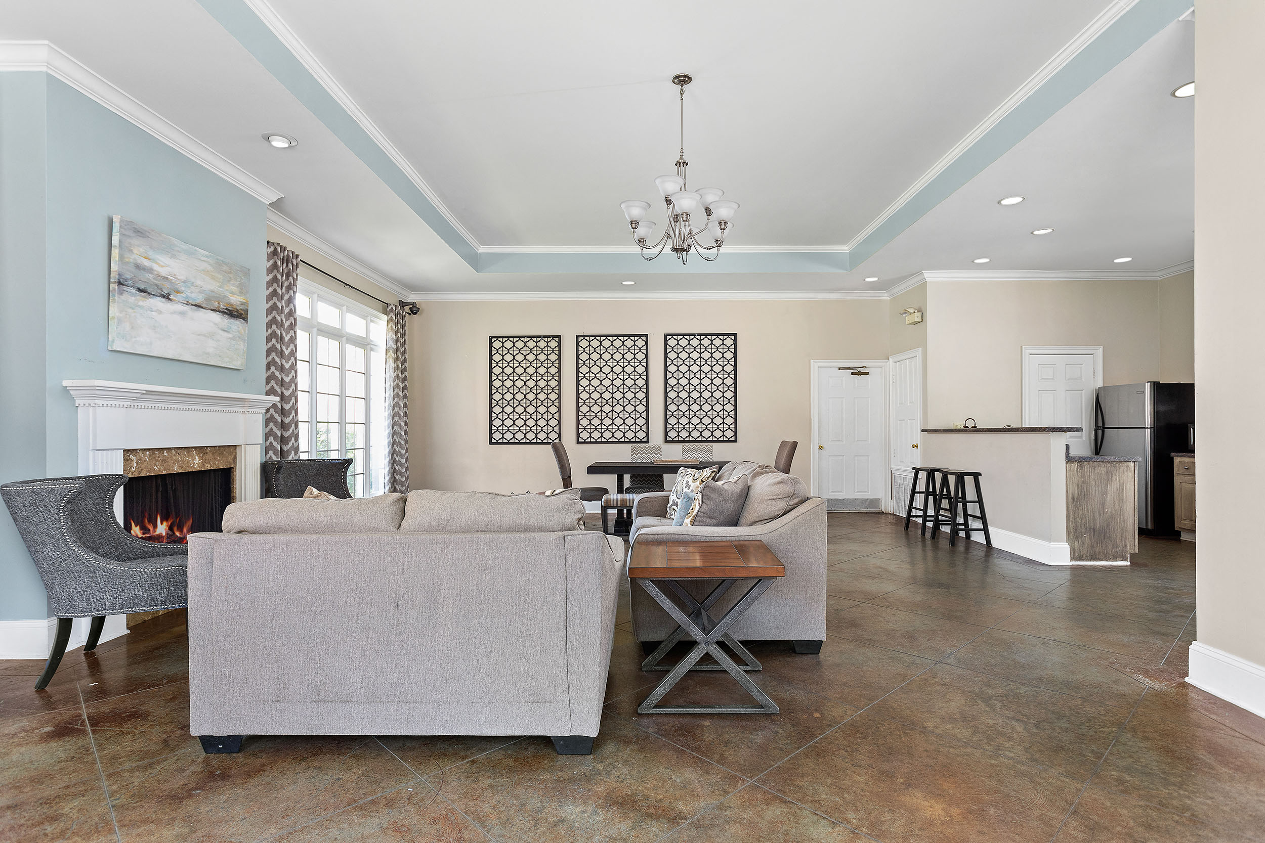 Community seating space next to spacious kitchen for residents of Walnut Hills Apartment Homes to gather