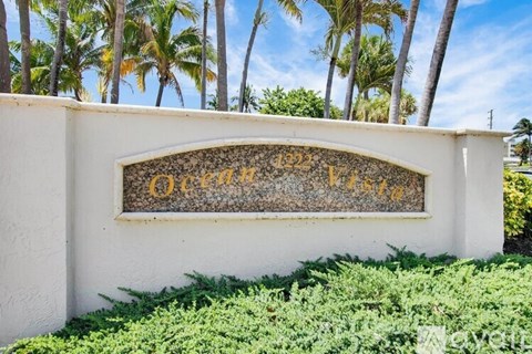 A sign that says "Ocean View" is mounted on a wall.