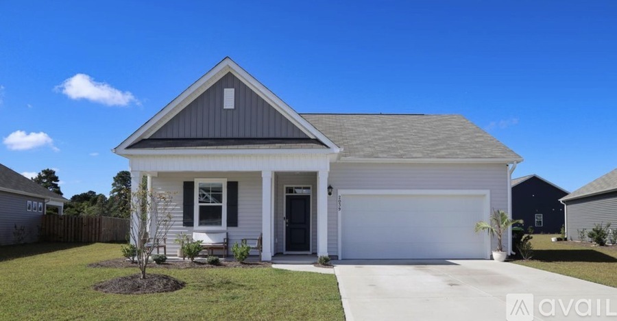 A house with a garage door is for sale.