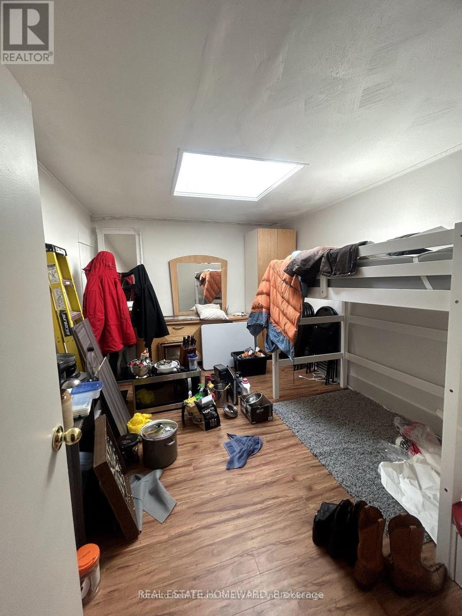 A bedroom with a bunk bed and a desk with a chair.