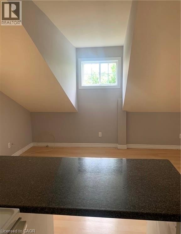 A room with a window and a counter top.