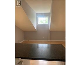 A room with a window and a counter top.