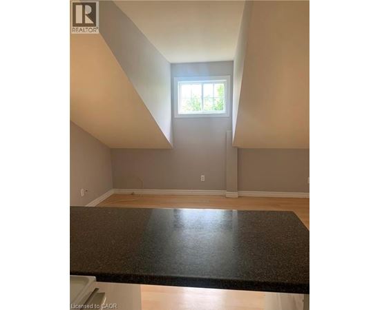 A room with a window and a counter top.