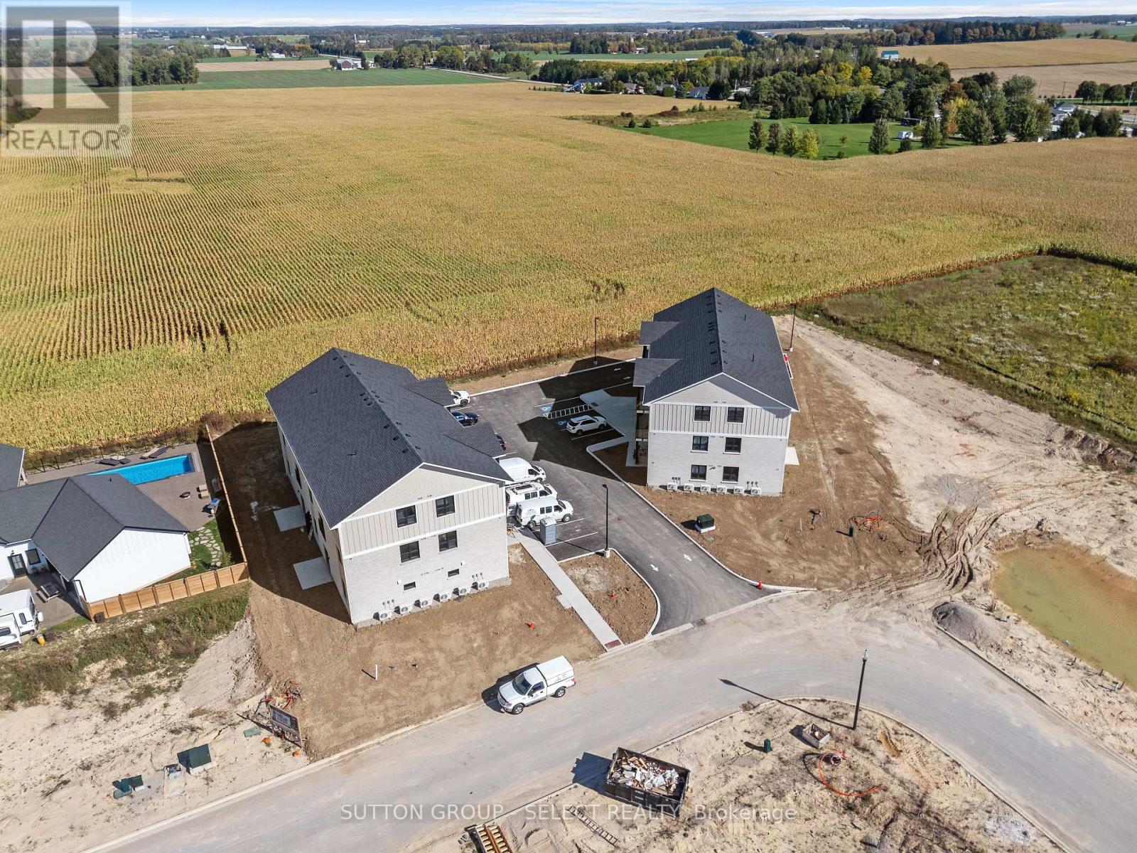 A real estate company is selling a property with a house and a swimming pool.