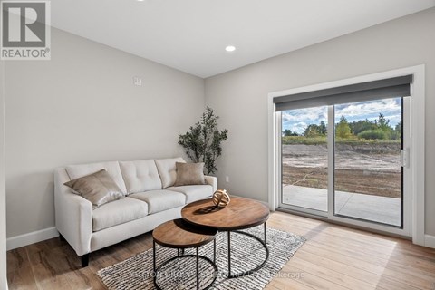 A living room with a white couch and a coffee table.