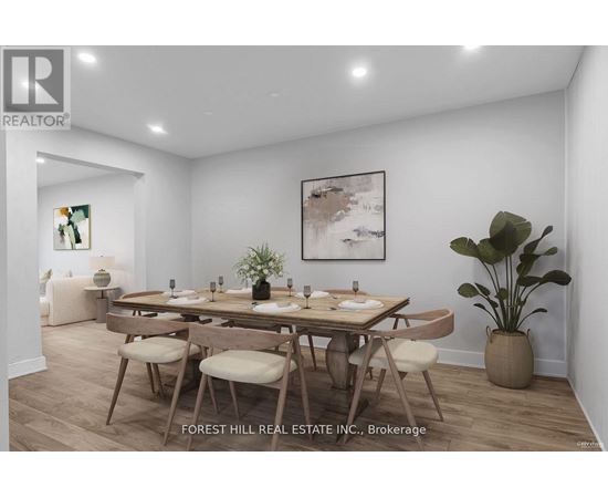 A dining room with a wooden table and chairs.