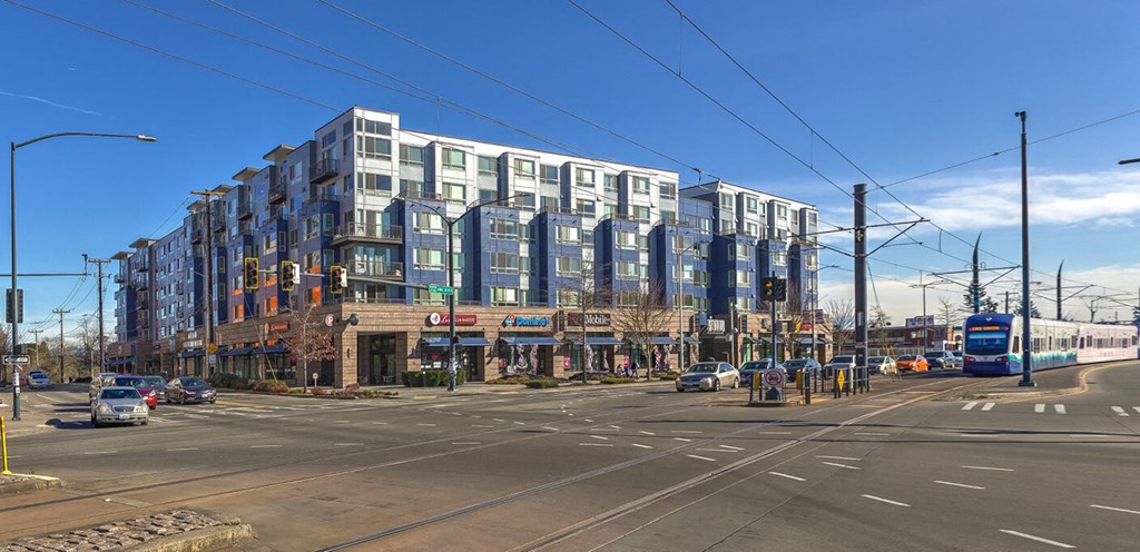 a large building on the corner of a city street