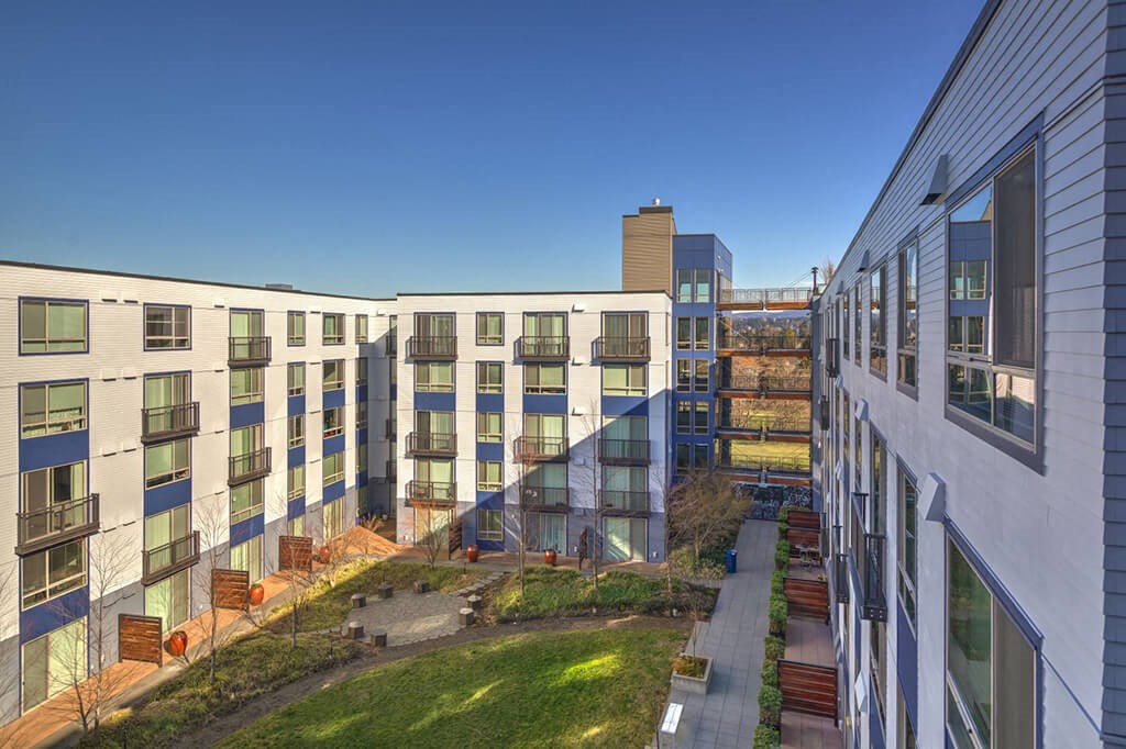 a view of the courtyard of an apartment building