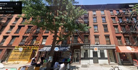 A street view of a building with a sign that reads "The Pink Elephant".