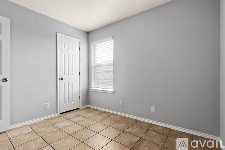 A room with a door and a window.