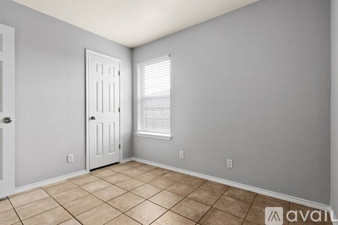 A room with a door and a window.