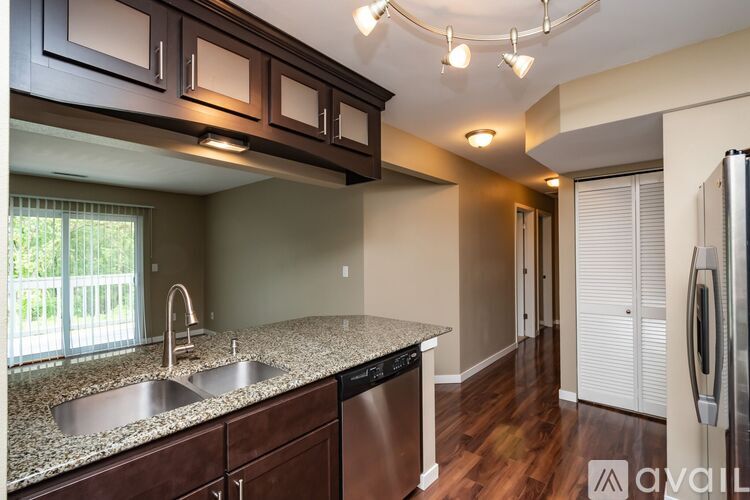 A kitchen with granite countertops and stainless steel appliances is available.