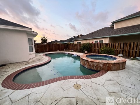 A backyard with a round pool and a hot tub.