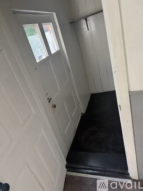 A small bathroom with a toilet, sink, and bathtub.