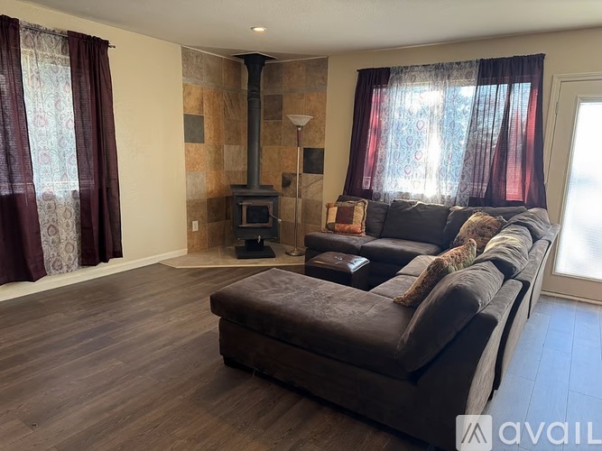 A living room with a fireplace and a couch.