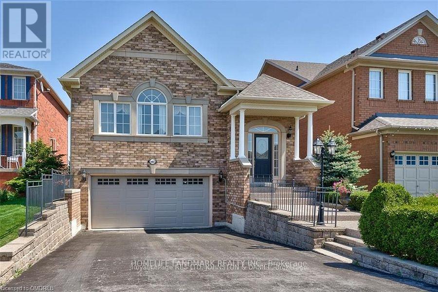 A house with a garage is for sale.