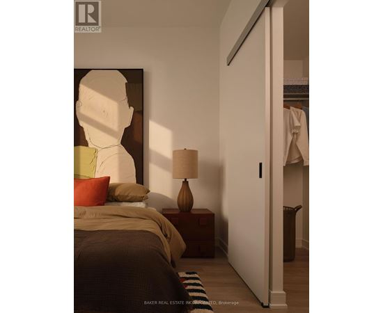 A spacious room with yoga mats and a pillar in the middle.