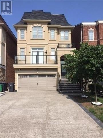 A two-story house with a garage and a tree in front.