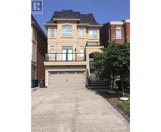A two-story house with a garage and a tree in front.