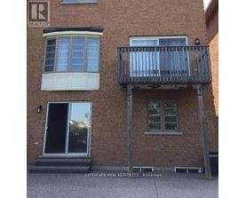 A building with a balcony and a window is for sale.