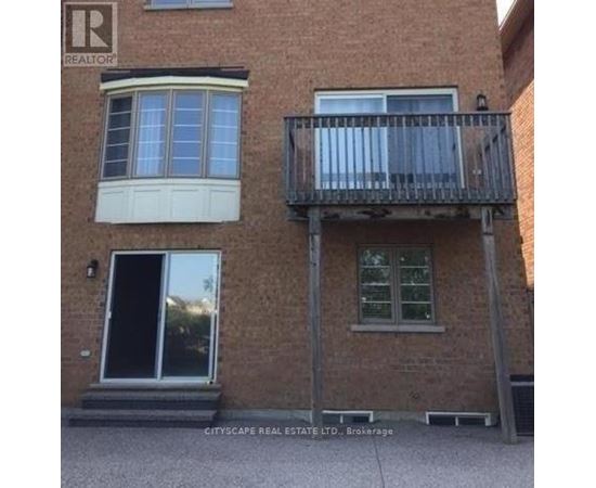 A building with a balcony and a window is for sale.