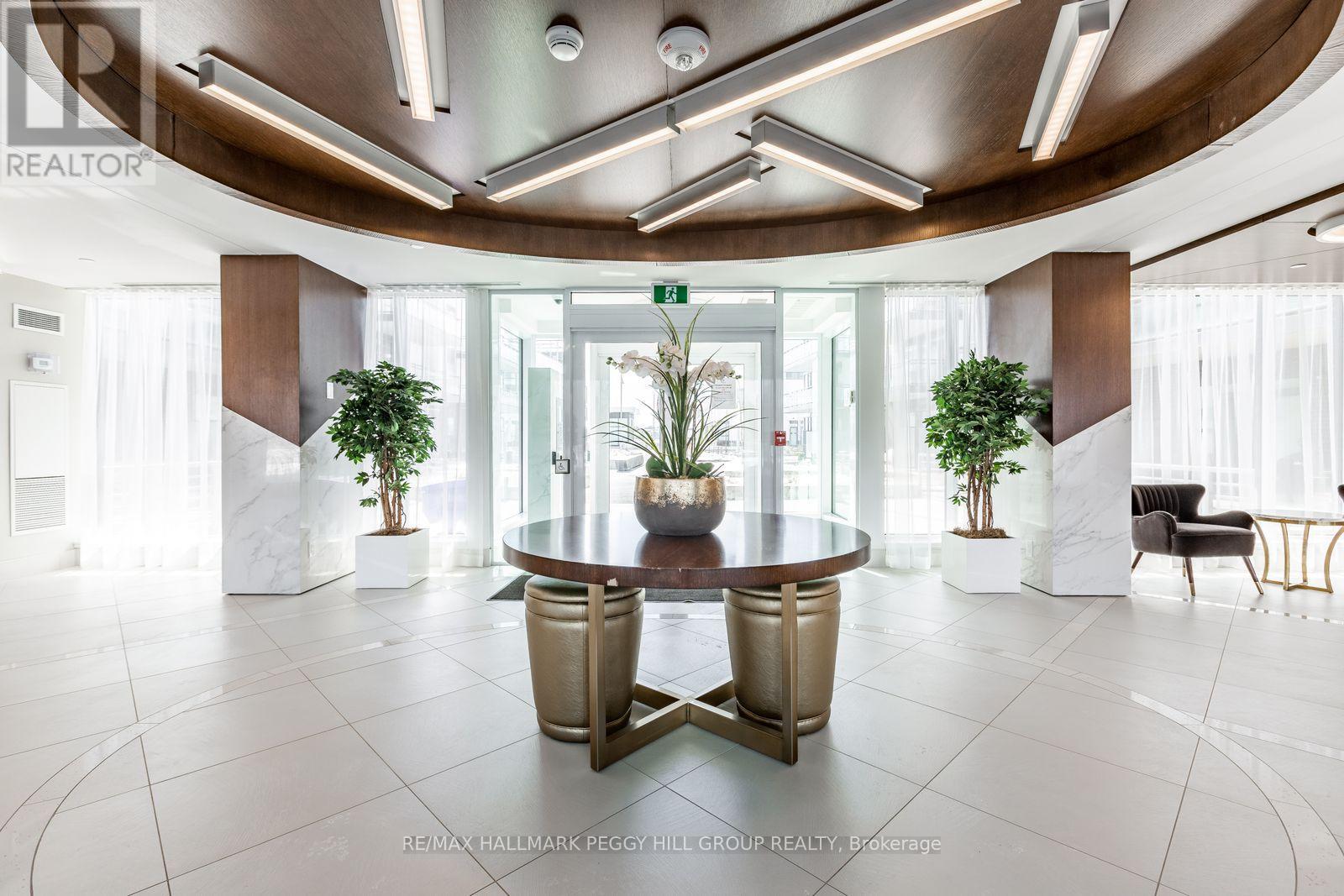 A modern office space with a glass table and chairs.