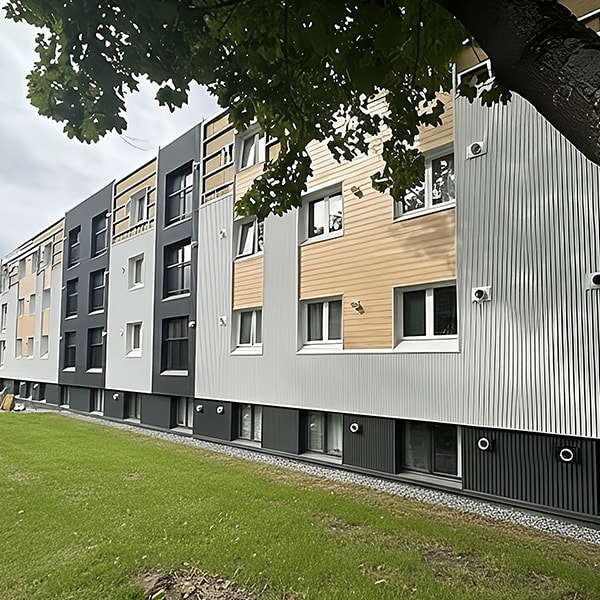 A modern building with a row of windows and balconies.