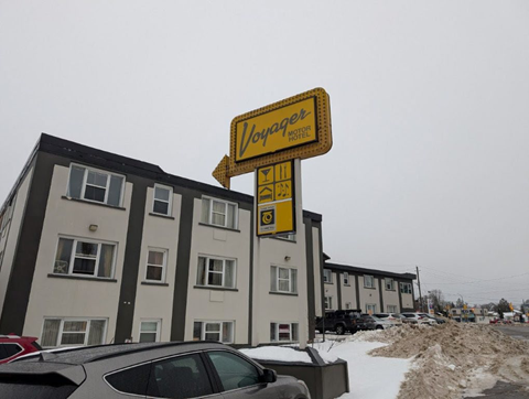 A Yogger Hotel sign is displayed in front of a building.