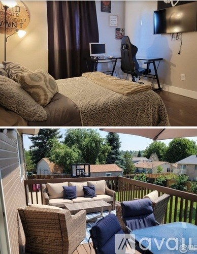 A bedroom with a bed and a desk with a chair.
