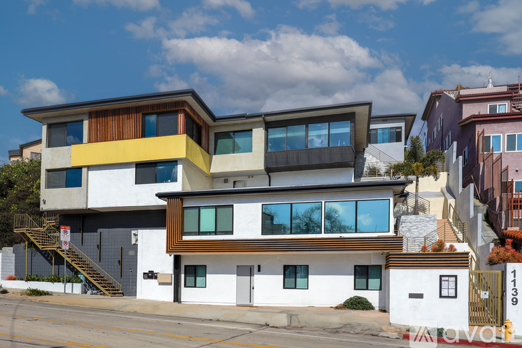 A modern two-story house with a white and brown exterior.