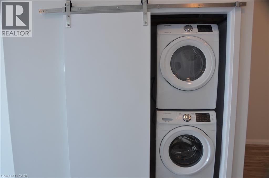 A white washing machine and dryer in a cabinet.