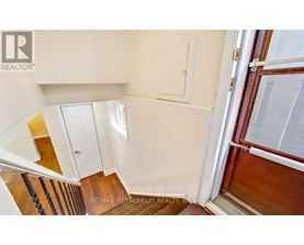 A view of a staircase leading to a second floor.