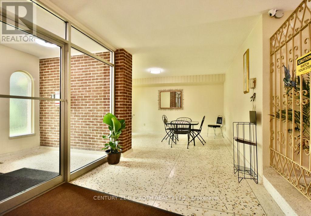 A living room with a glass door leading to a balcony.